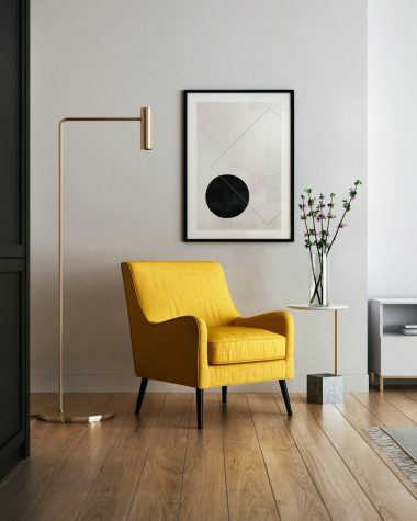 brown wooden framed yellow padded chair