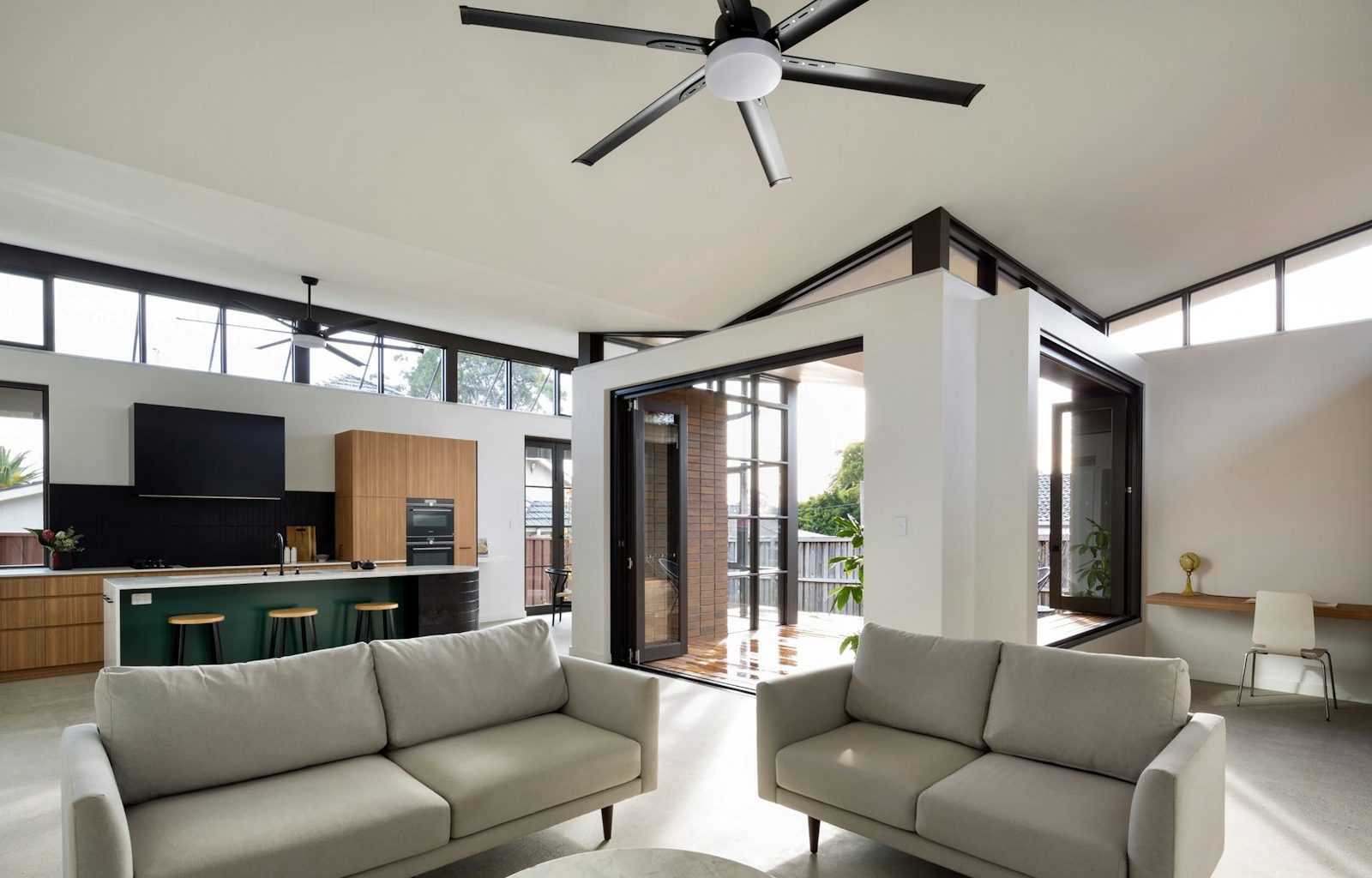 a living room with a large ceiling fan