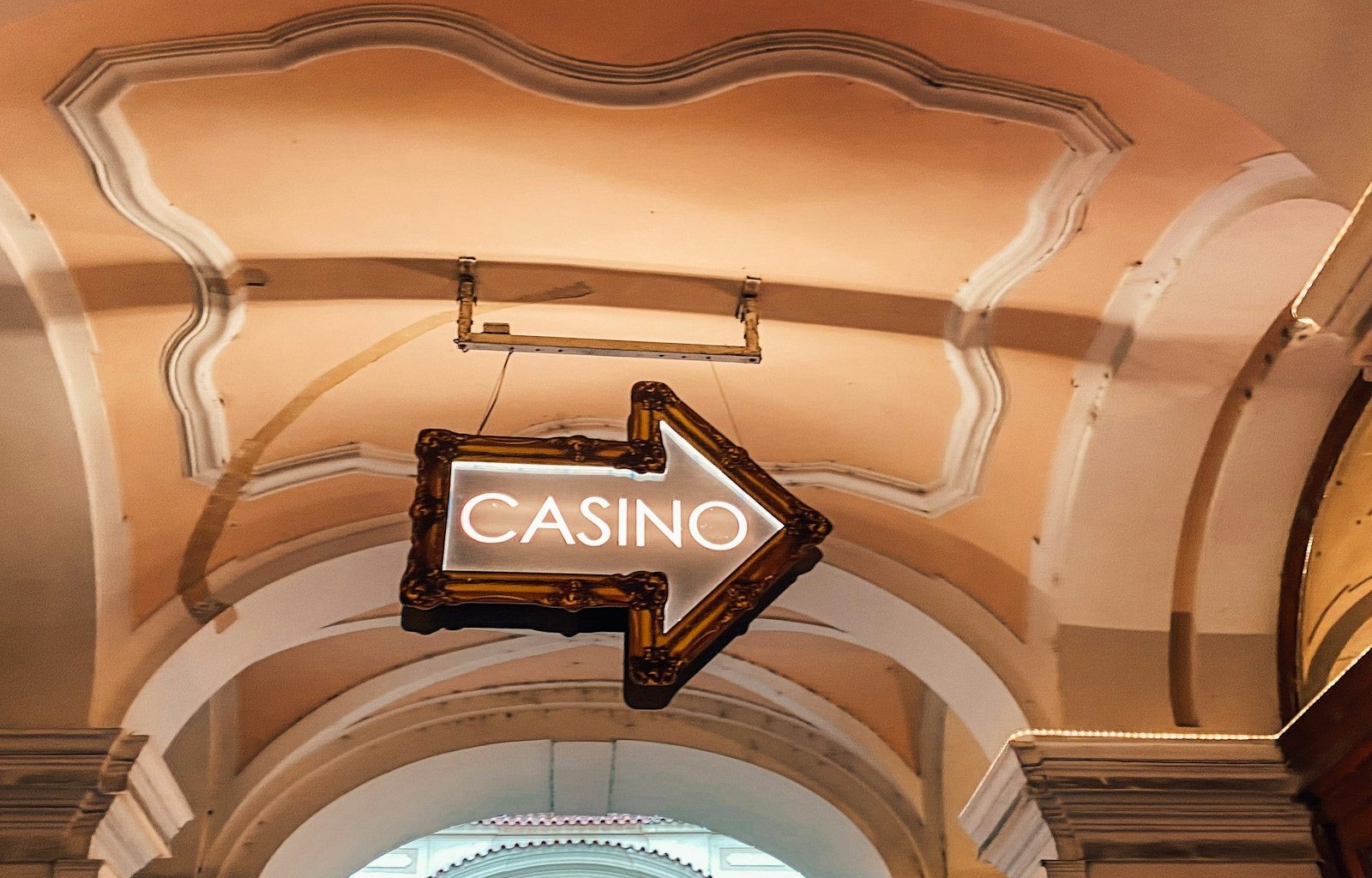 a casino sign hanging from the ceiling of a building