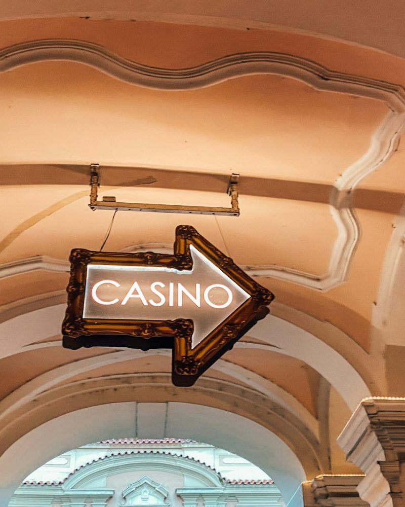 a casino sign hanging from the ceiling of a building