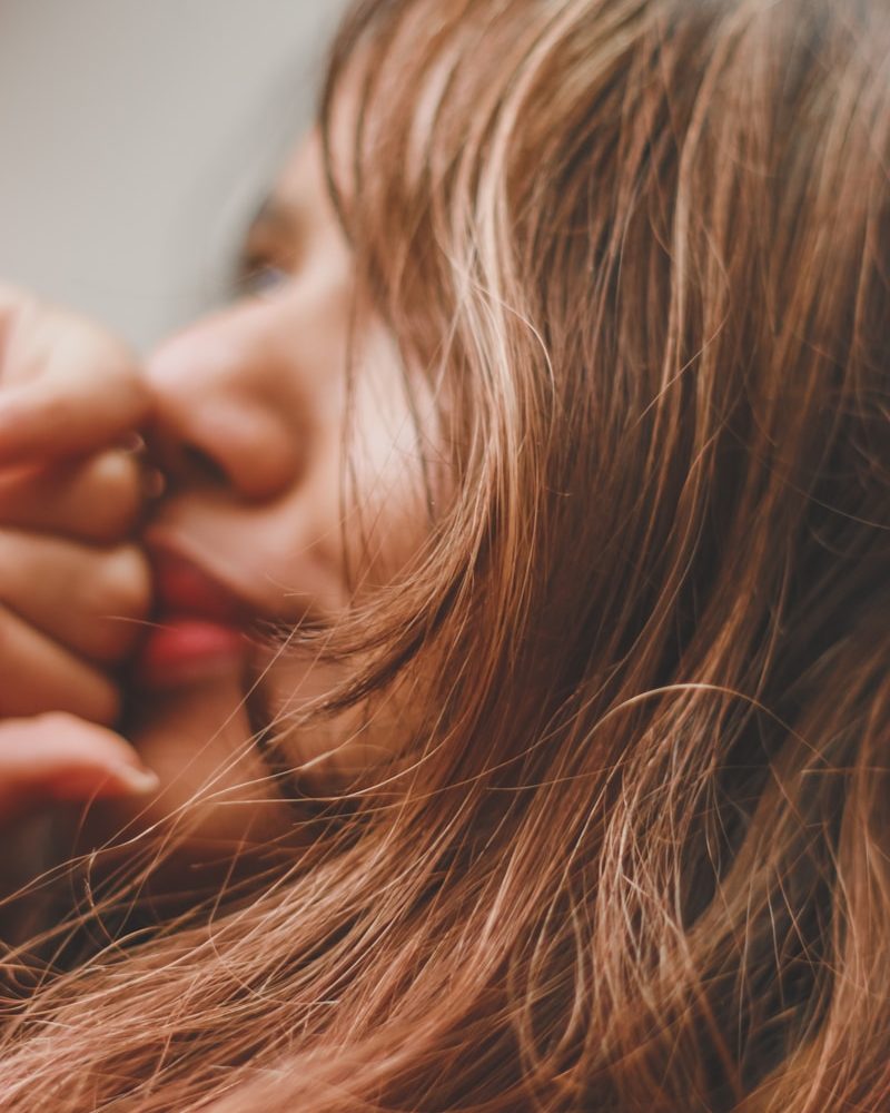 a close up of a person with long hair