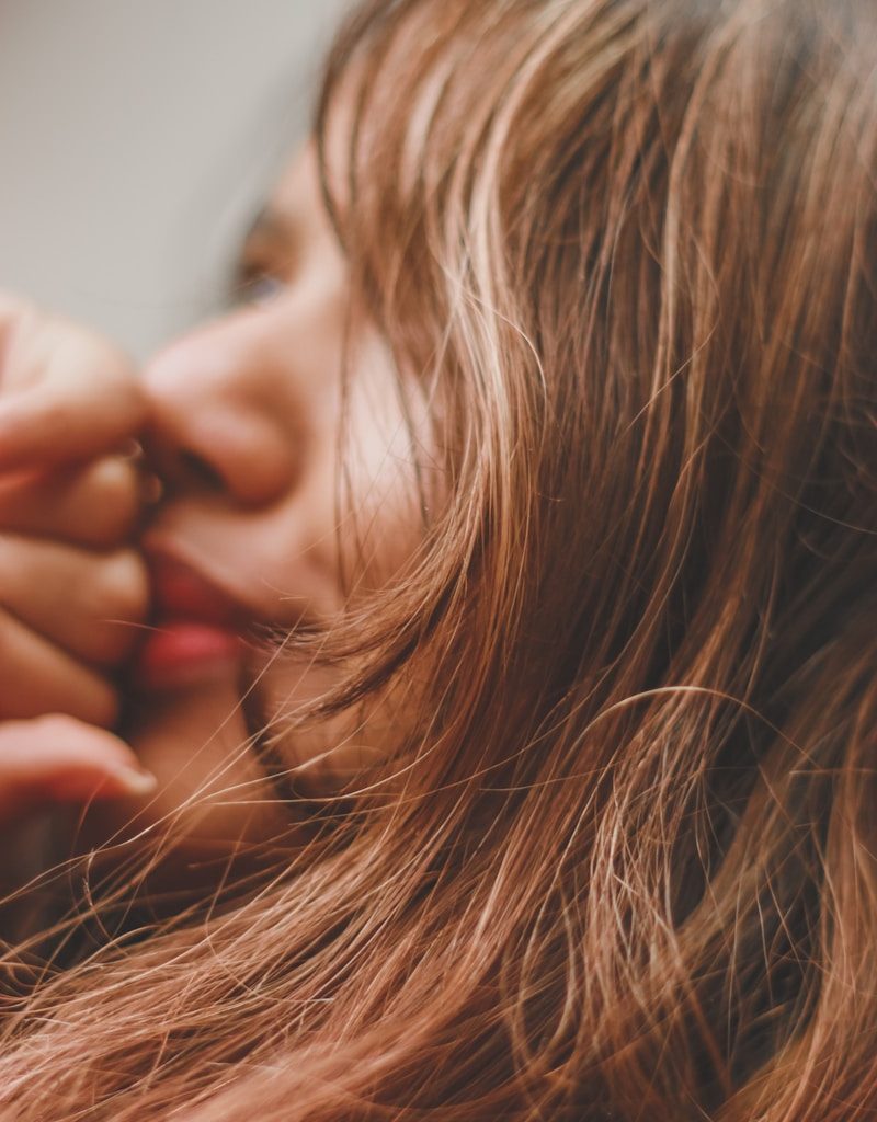 a close up of a person with long hair