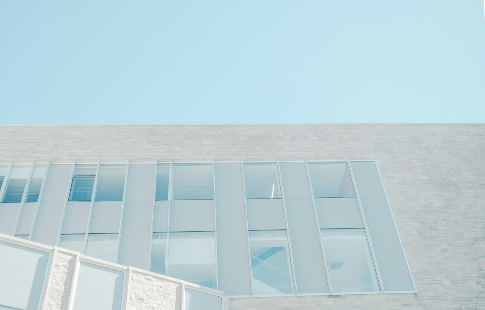 A stairwell in a building seen through its windows