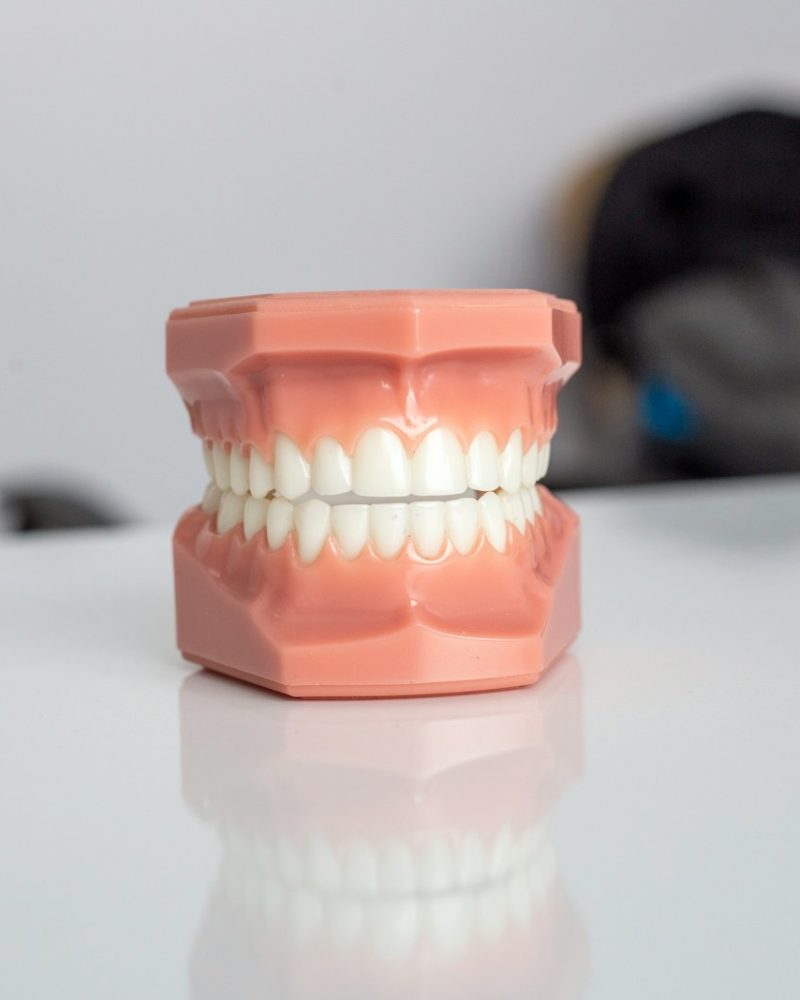 orange plastic container on white table